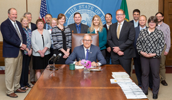 photo of paint bill signing ceremony